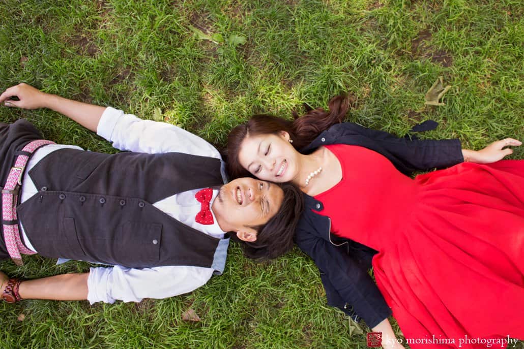Japanese couple lying head to head on the grass in Central Park photographed by Kyo Morishima