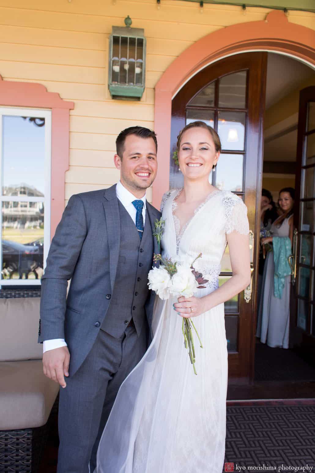 Portrait of the bride and groom on the Ocean Plaza Hotel front porch in Asbury Park, photographed by Kyo Morishima