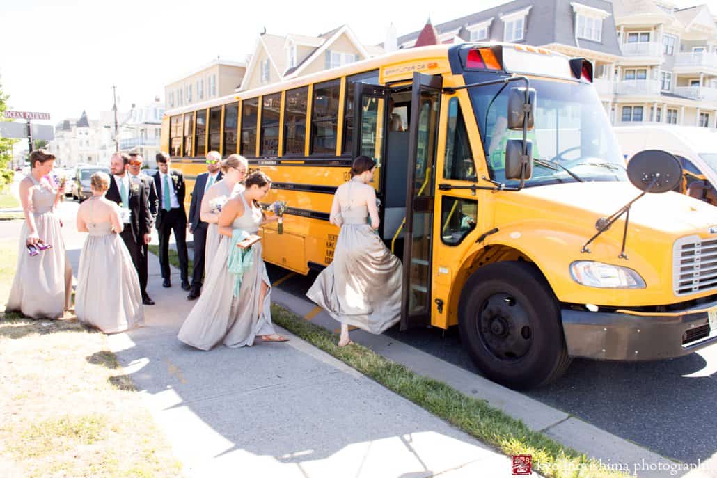 Wedding party rides a school bus to the boardwalk for wedding portraits in Asbury Park, photographed by Kyo Morishima