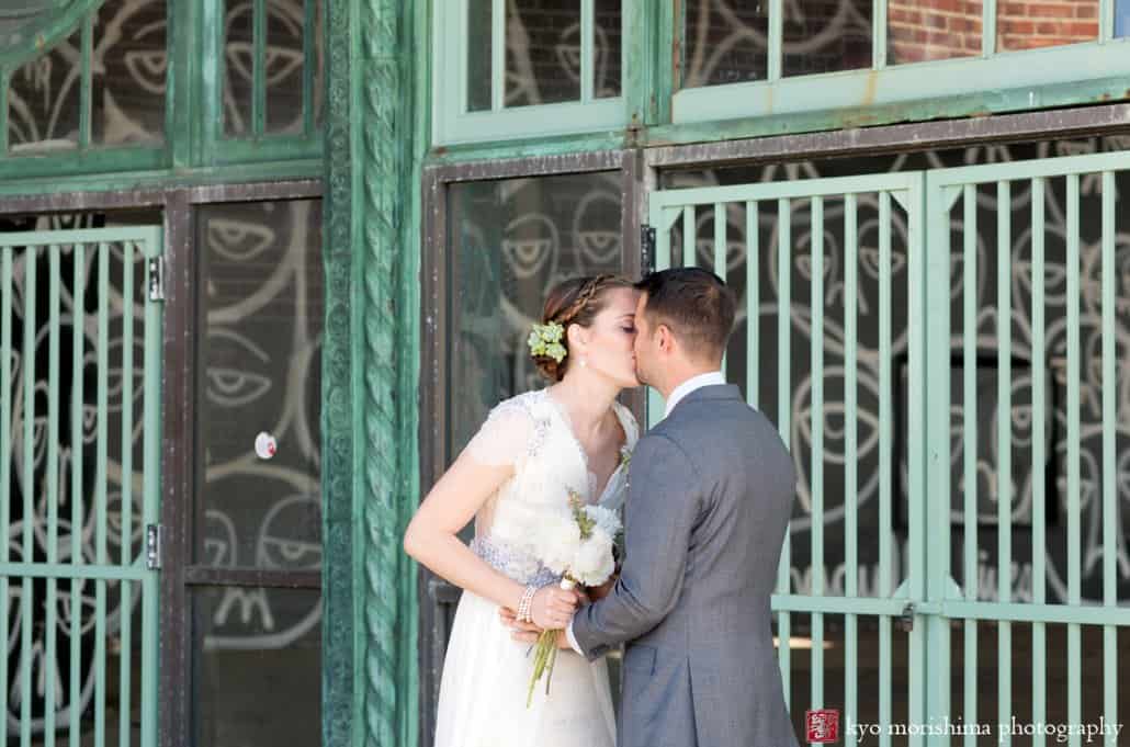 Bride and groom kiss during Asbury Park Casino wedding portrait shoot, photographed by Kyo Morishima