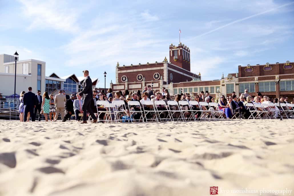 Guests assemble on the beach for Asbury Park wedding outside Tim McLoone's Supper Club, photographed by Kyo Morishima