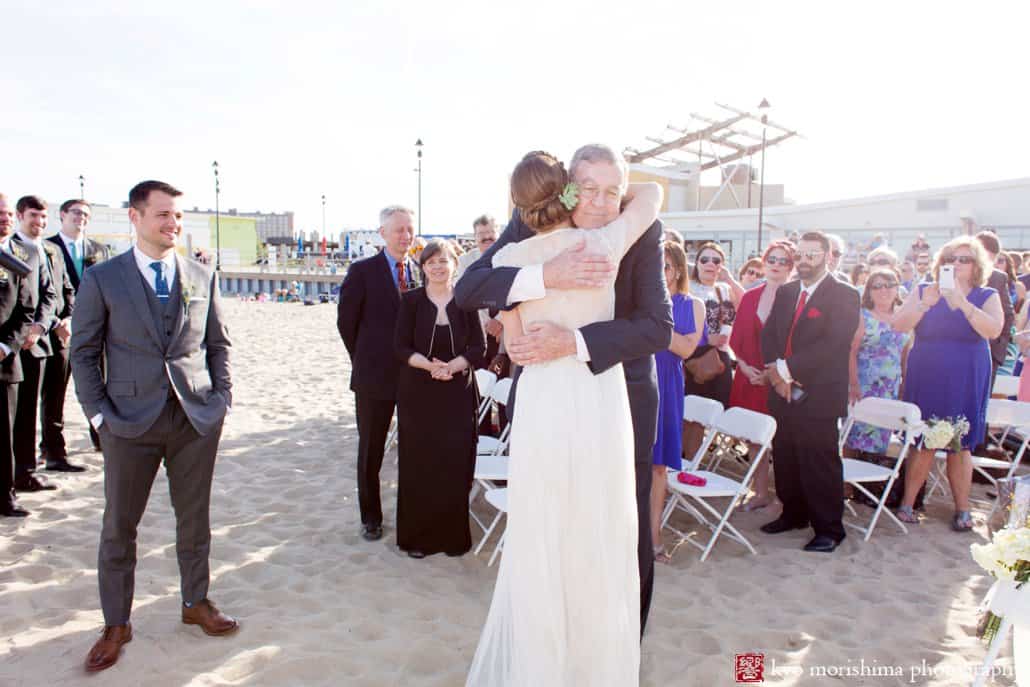 Father and daughter embrace as Asbury Park wedding ceremony begins, photographed by Kyo Morishima