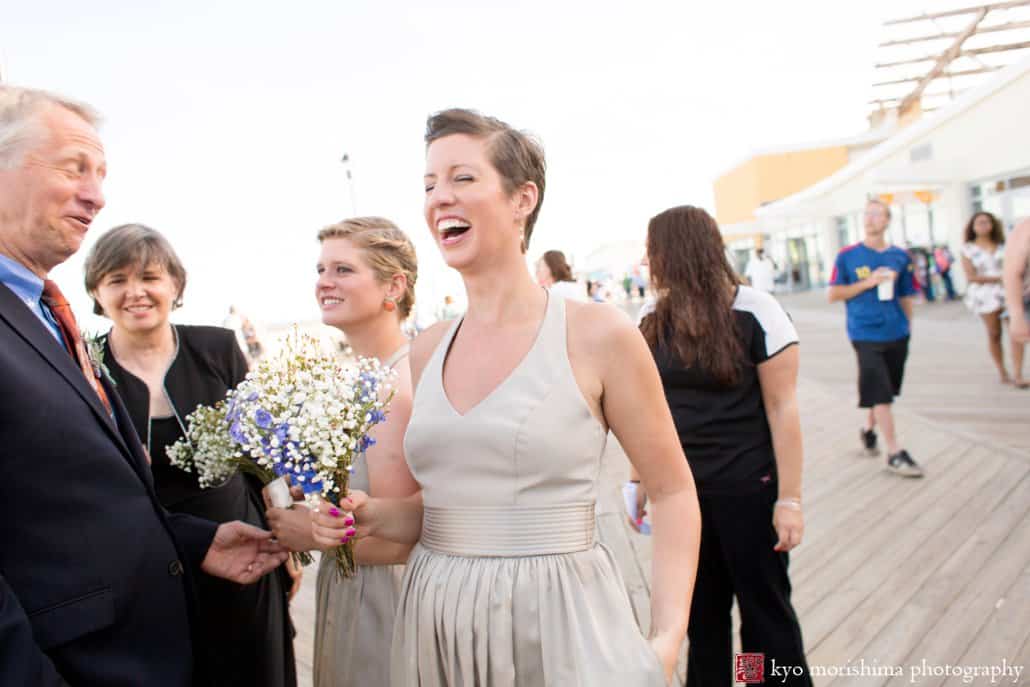 Guests celebrate on boardwalk after Asbury Park beach wedding ceremony photographed by Kyo Morishima