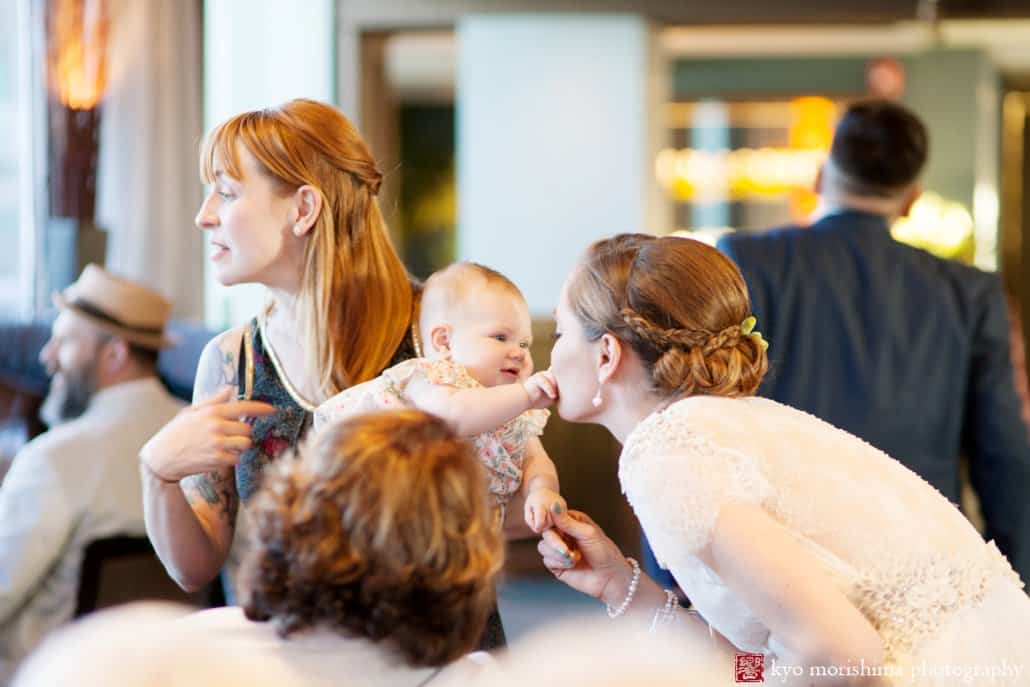 Baby pinches bride's nose during Tim McLoone's Supper Club wedding photographed by Kyo Morishima