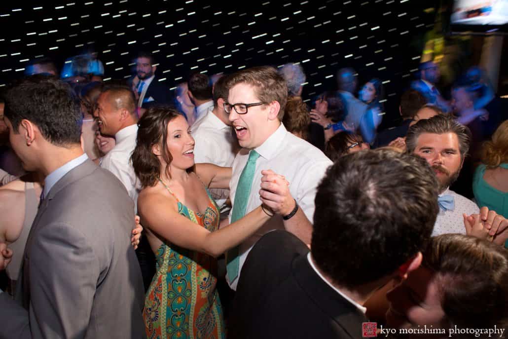 Guests have fun on the dance floor during Tim McLoone's Supper Club wedding in Asbury Park, photographed by Kyo Morishima