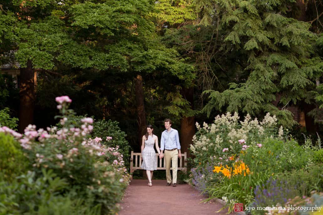 Couple walks down a path in Prospect Gardens Princeton engagement photo photographed by Kyo Morishima