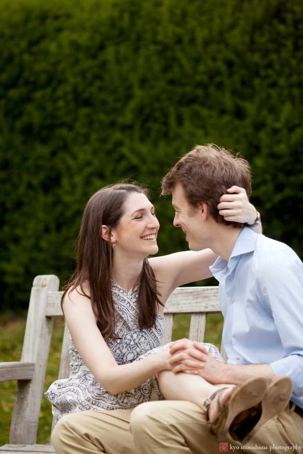Couple sits on a bench in Prospect Gardens Princeton engagement photo photographed by Kyo Morishima