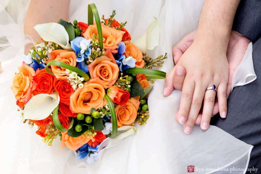 Bride carries colorful orange, blue, and white wedding bouquet from Whole Foods, photographed by Kyo Morishima