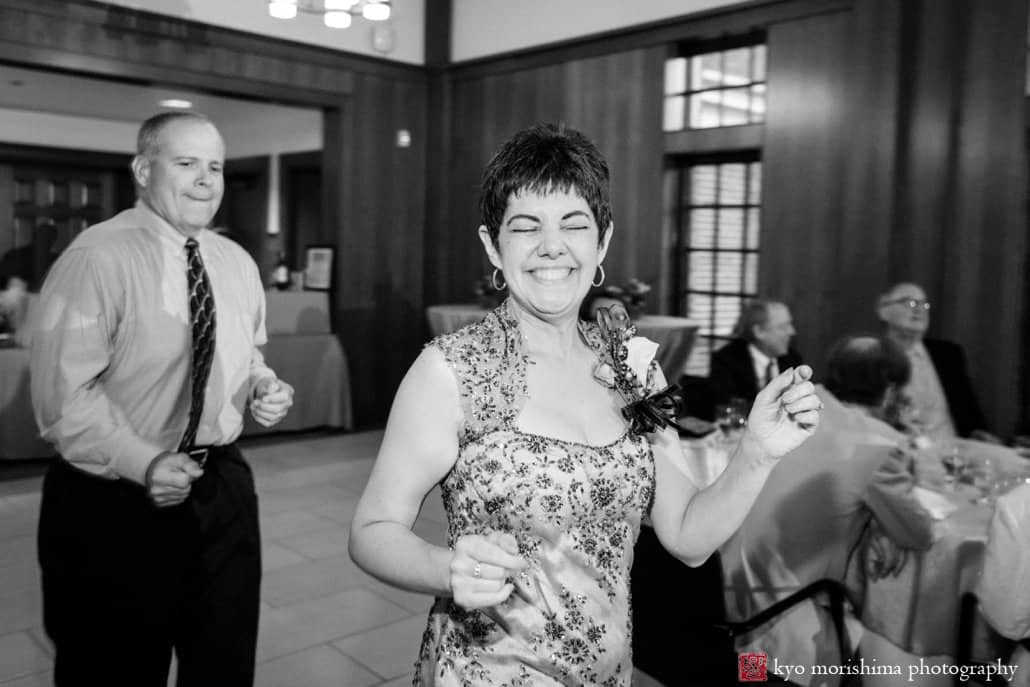Mother of the bride smiles during Cap and Gown Club wedding reception photographed by Kyo Morishima