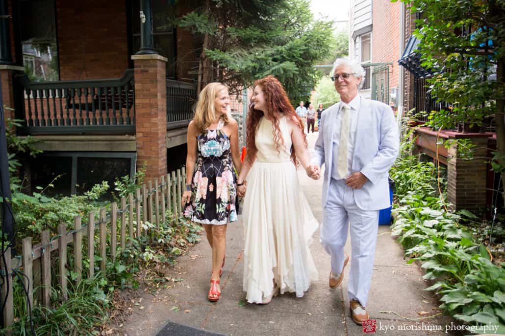 Parents walk bride down the driveway as block party wedding in Philadelphia begins, photographed by Kyo Morishima