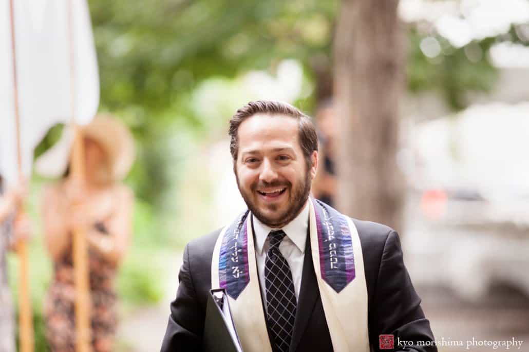 Rabbi Eli Freedman of Congregation Rodeph Shalom smiles after officiating an outdoor wedding ceremony in West Philadelphia, photographed by Kyo Morishima