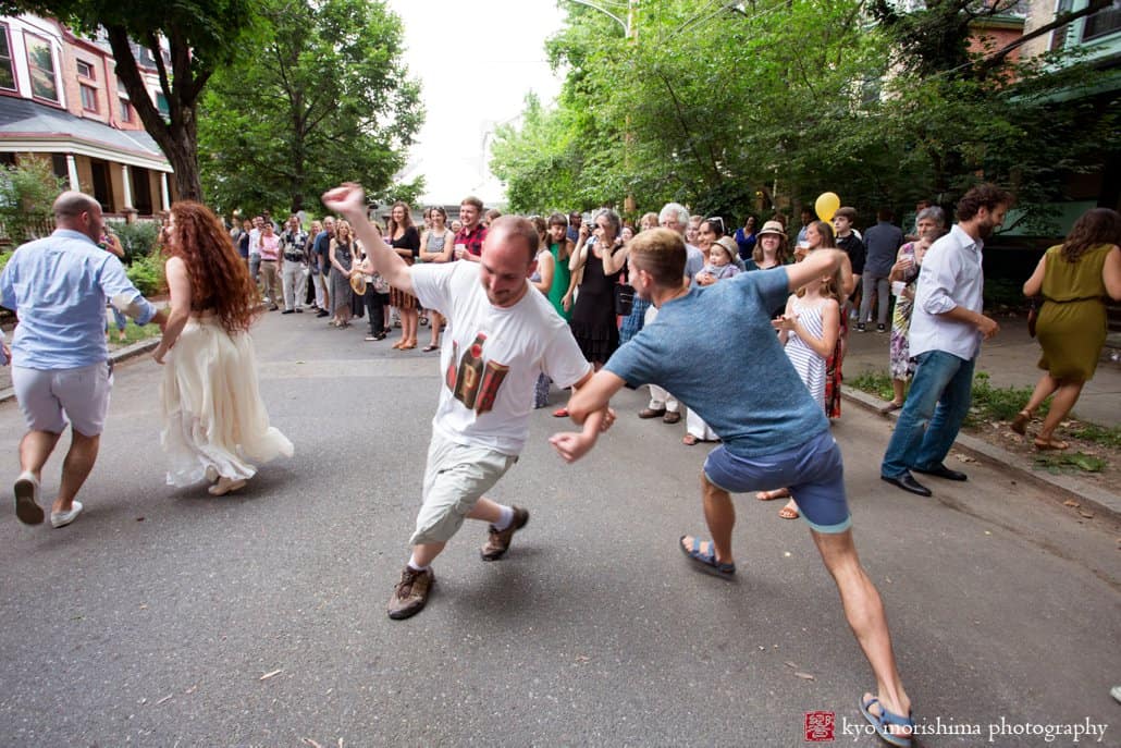 Wedding guests dance to music by West Philly Orchestra during block party wedding photographed by Kyo Morishima
