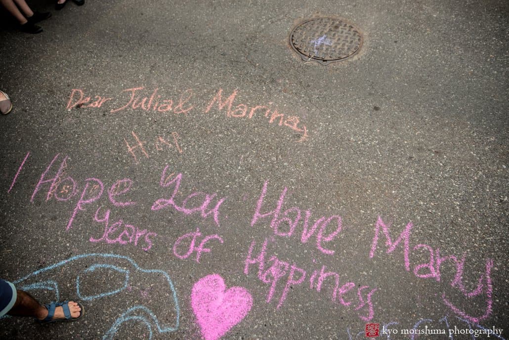 Sidewalk chalk message to the brides at West Philadelphia block party wedding photographed by Kyo Morishima
