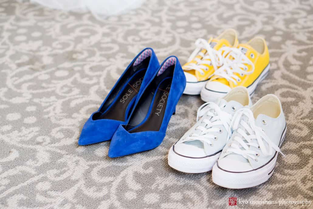 Royal blue wedding shoes and Converse sneakers on the floor of the bridal suite at Perona Farms wedding photographed by Kyo Morishima