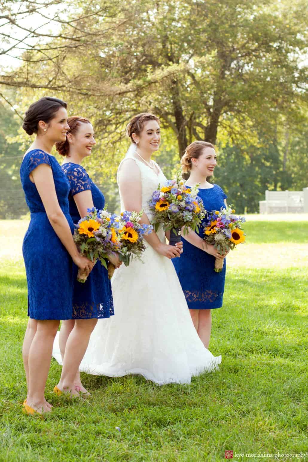 Bride and bridesmaids smile for pictures, holding cottage garden wedding bouquets by Cindy Rieken, photographed by Perona Farms wedding photographer Kyo Morishima