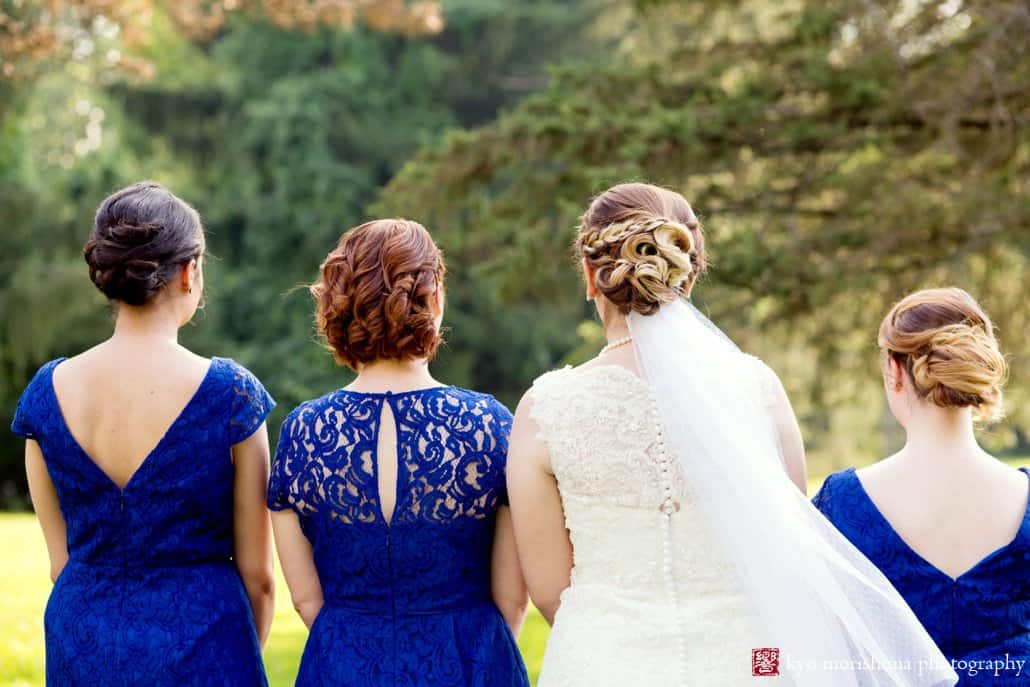 Portrait of bride and bridesmaids from the back, with hair styled by Lena LaMonaco, photographed by Kyo Morishima
