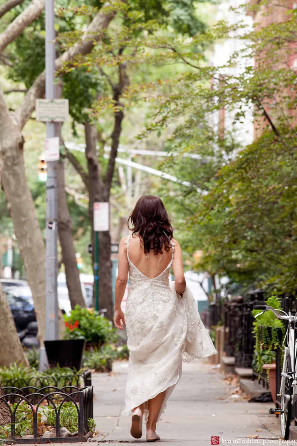 Bride wearing Maggie Sottero wedding dress walks down city street in Cobble Hill getting ready, photographed by Kyo Morishima