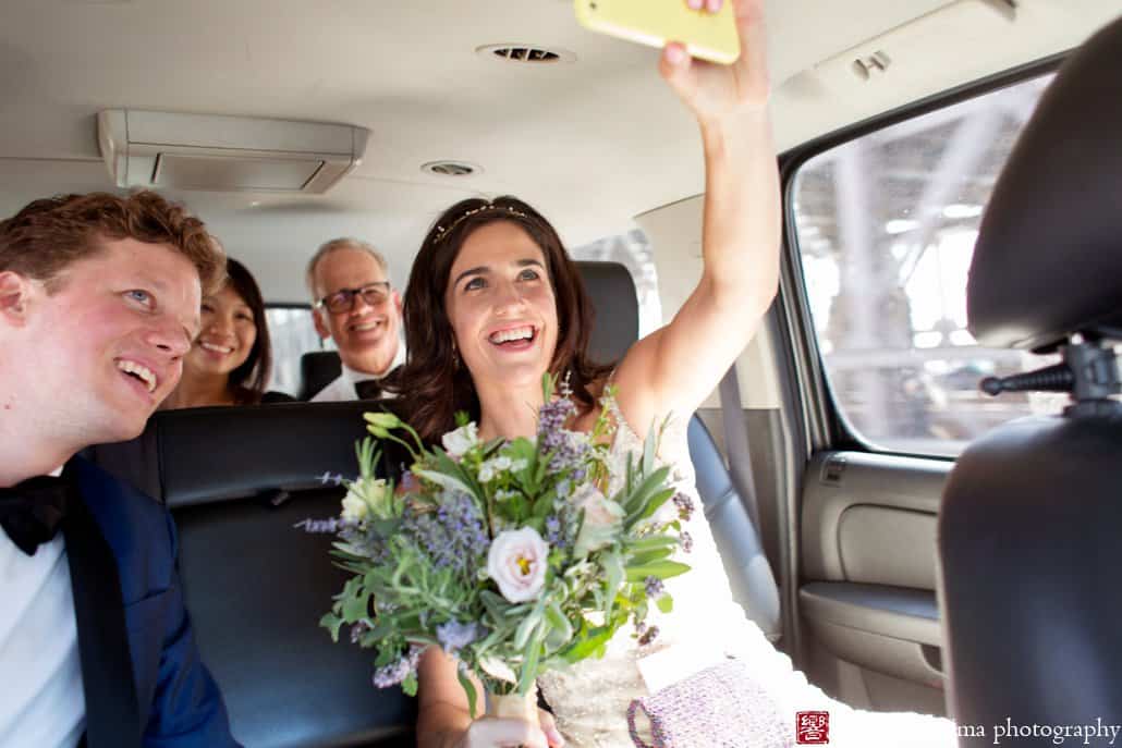 Bride takes a selfie while in Uber car on the way to their wedding, photographed by Kyo Morishima