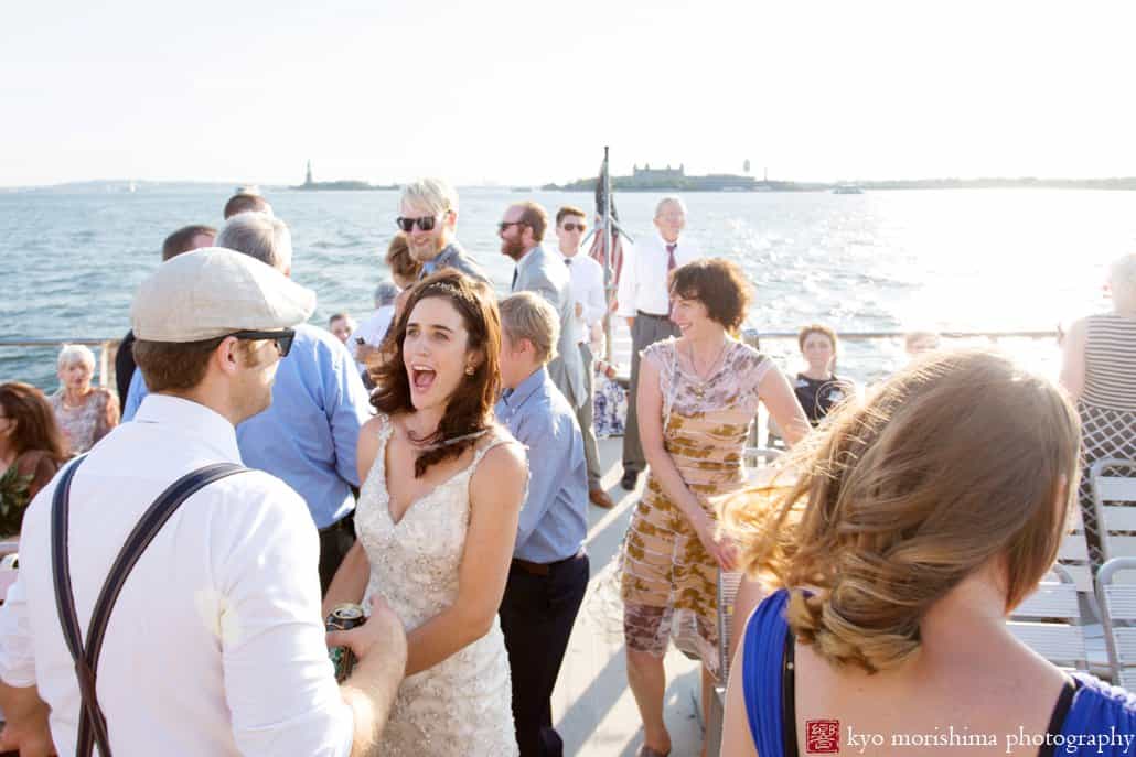 Bride mingles with wedding guests on board NYC water taxi, photographed by Kyo Morishima