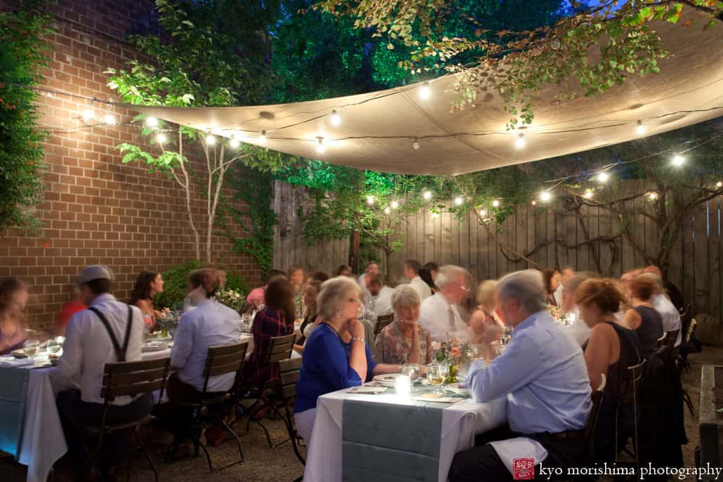 Guests enjoy dinner outside at Frankies 457 Spuntino, photographed by Cobble Hill wedding photographer Kyo Morishima