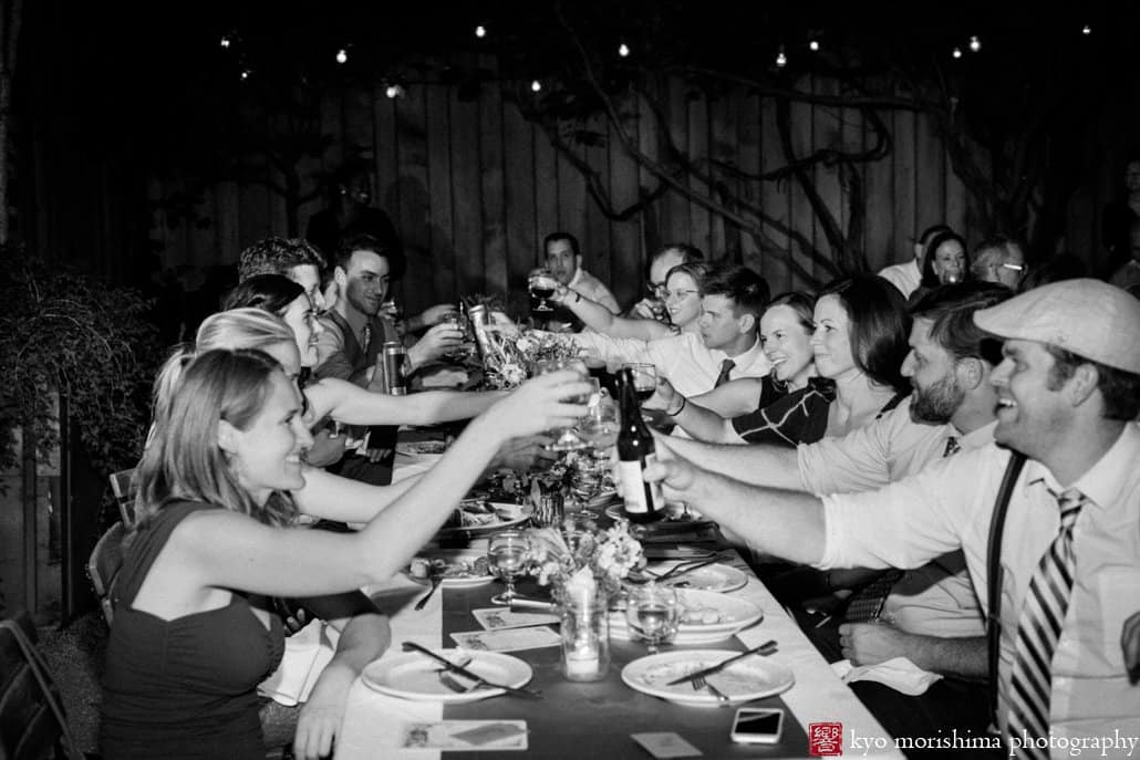 Guests toast during Frankies 457 Spuntino wedding reception, photographed by Kyo Morishima