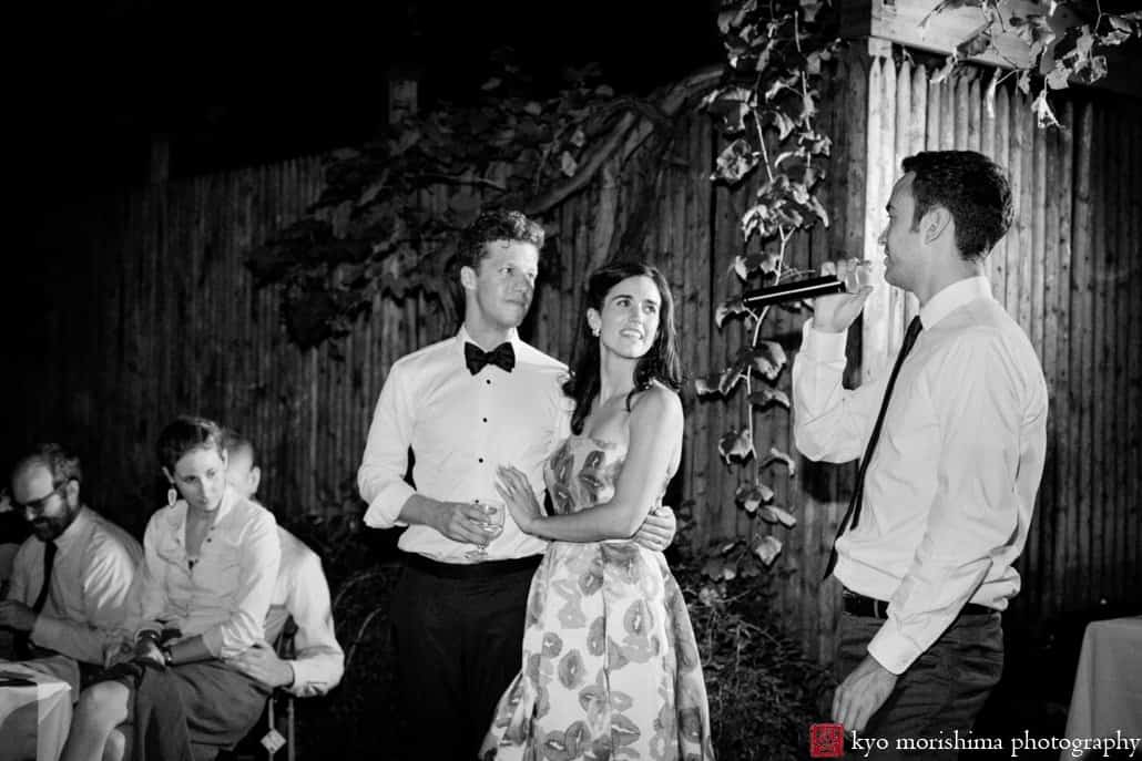 A toast in the courtyard at Frankies 457 Spuntino wedding reception, photographed by Kyo Morishima