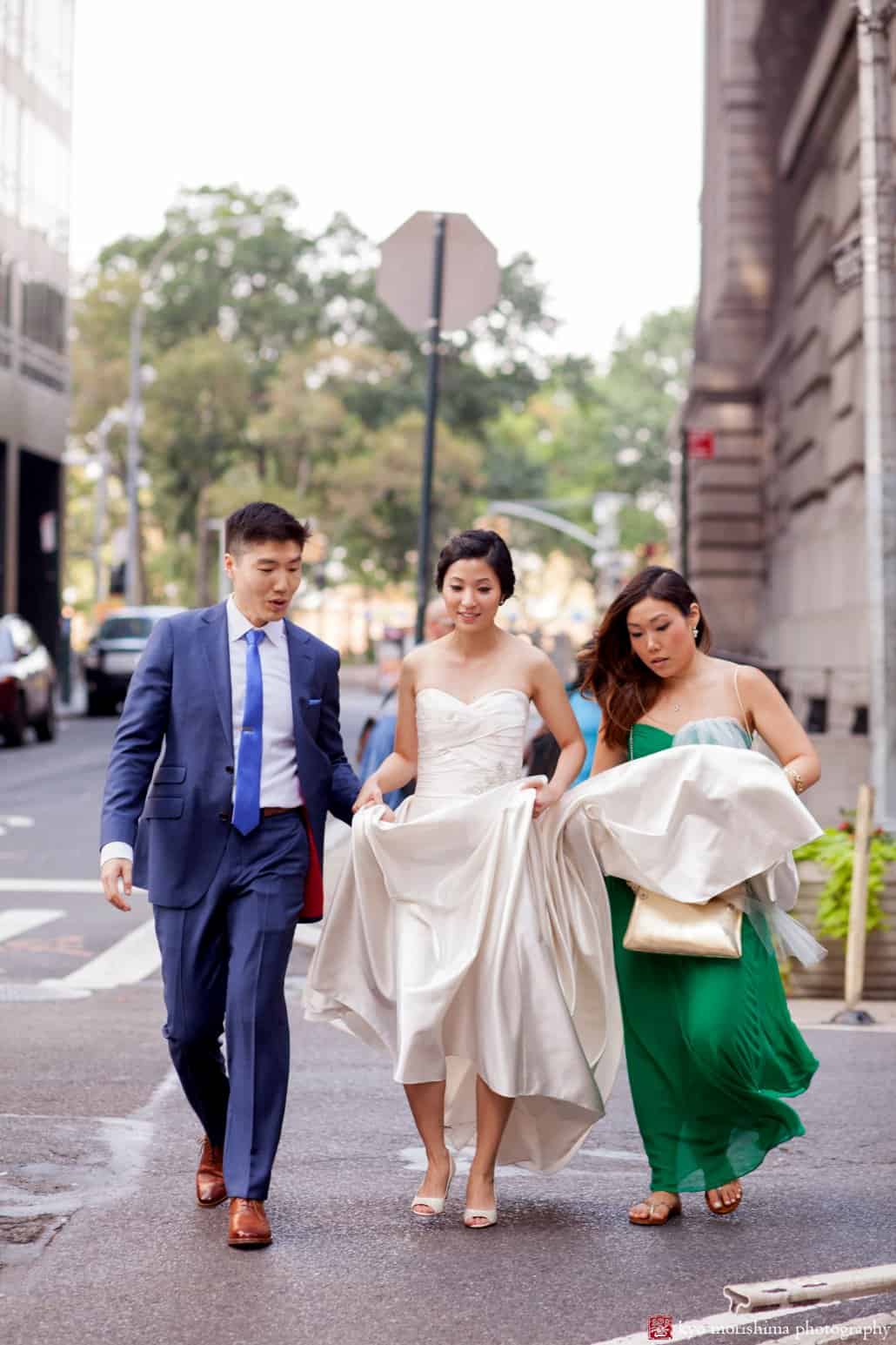 Bride with bridesmaid and groom head to India House for wedding ceremony, photographed by Wall Street wedding photographer Kyo Morishima