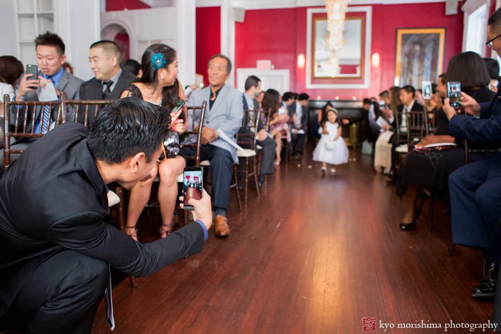 Flower girl heads down the aisle at India House wedding, photographed by Kyo Morishima