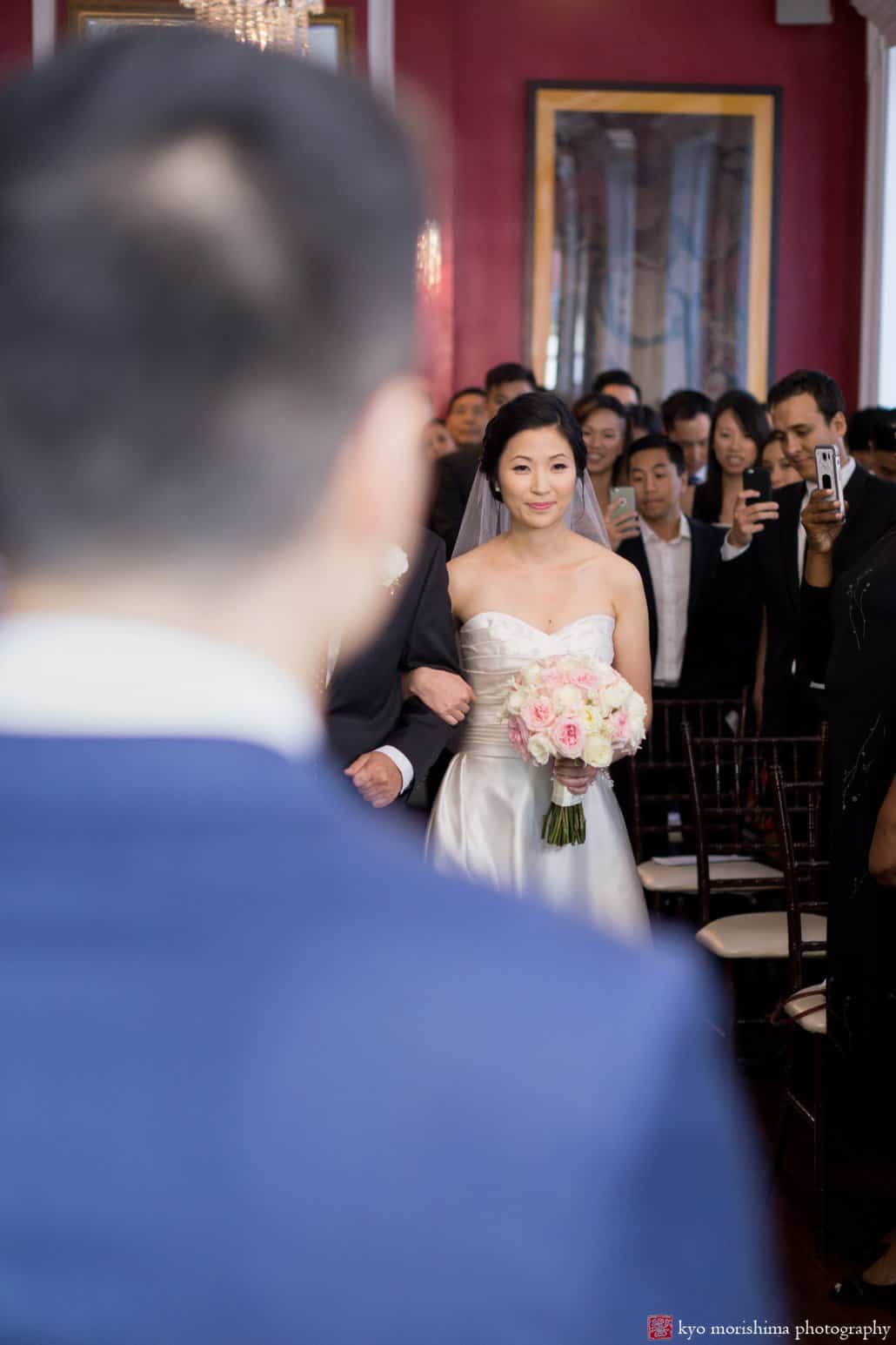 Groom watches bride approach at start of India House wedding, photographed by Kyo Morishima