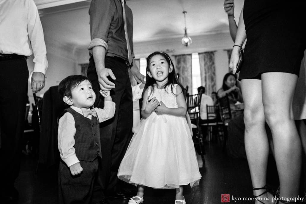 Flower girl enjoys the dancing at India House wedding photographed by Korean wedding photographer Kyo Morishima