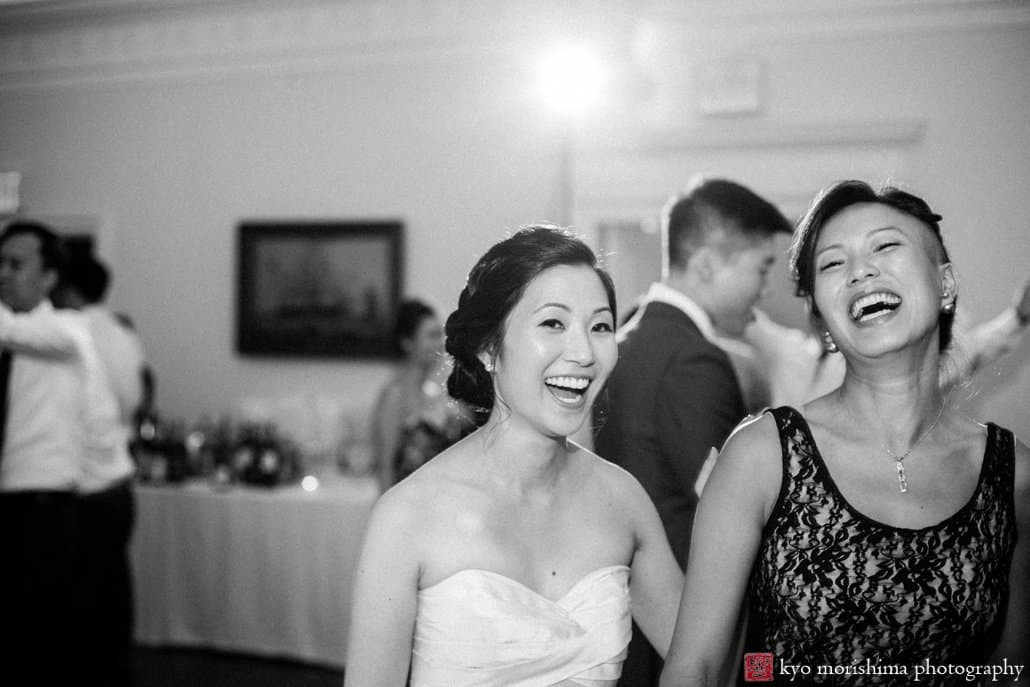 Korean bride and friend laugh together during India House wedding photographed by Kyo Morishima