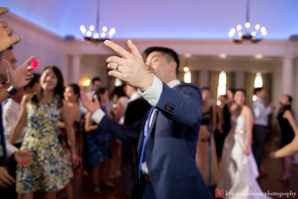 Groom enjoys himself on the dance floor at India House wedding photographed by Kyo Morishima