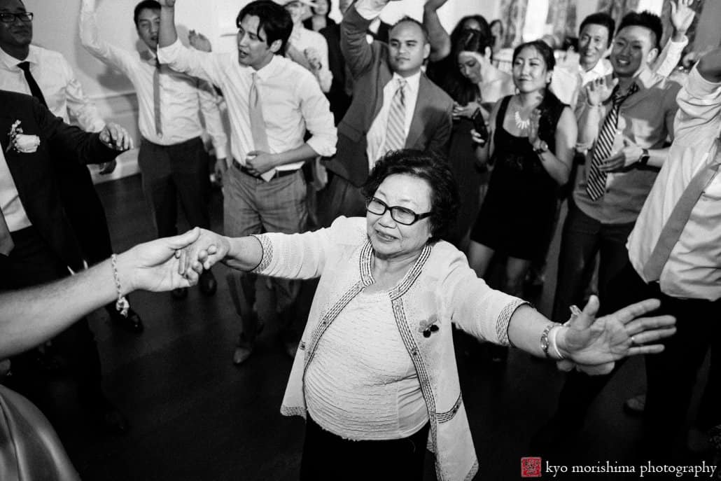 Korean grandmother dances during wedding reception at India House, photographed by Kyo Morishima