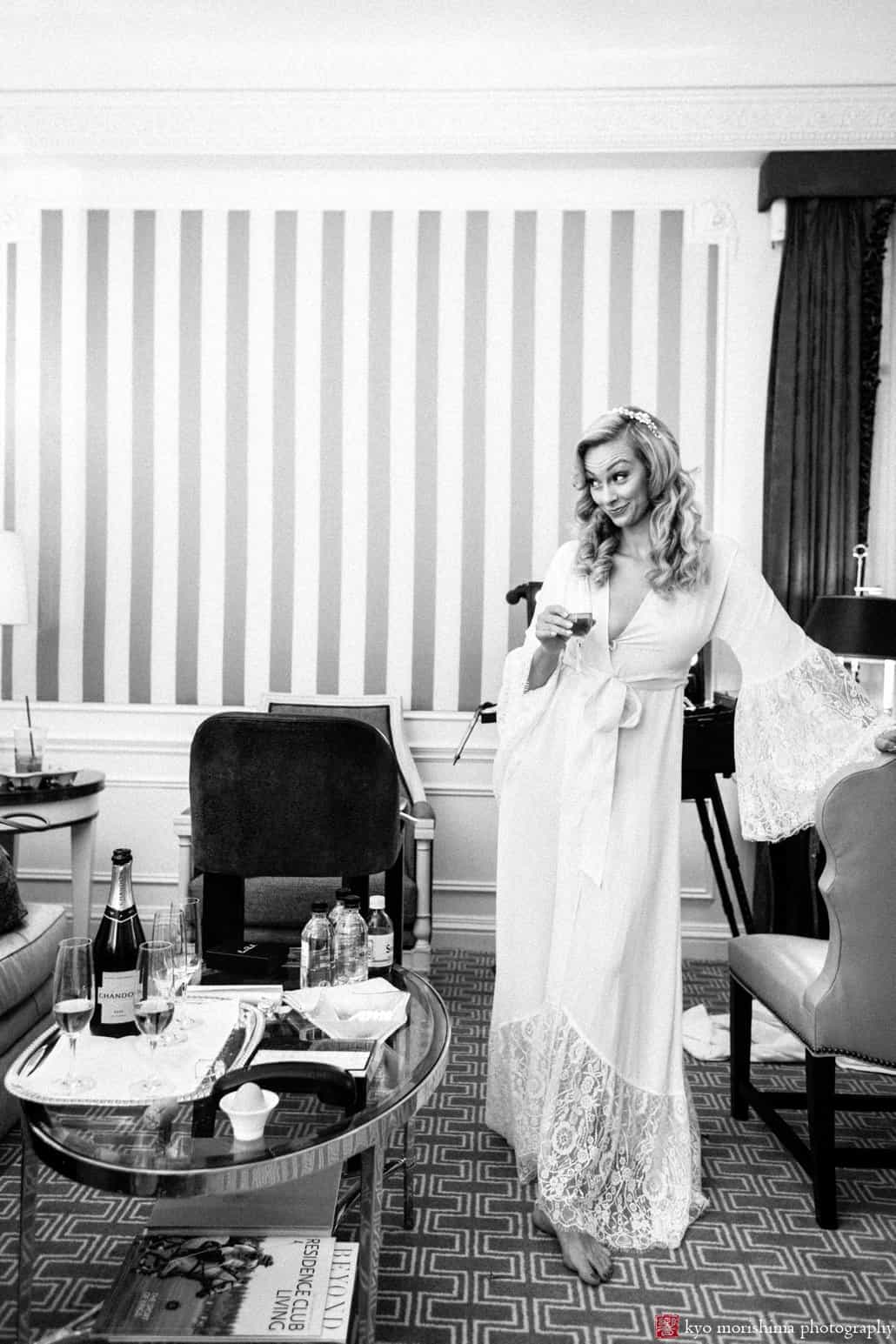 Bride lifts an eyebrow while getting ready at St. Regis Hotel in NYC, photographed by candid wedding photographer Kyo Morishima
