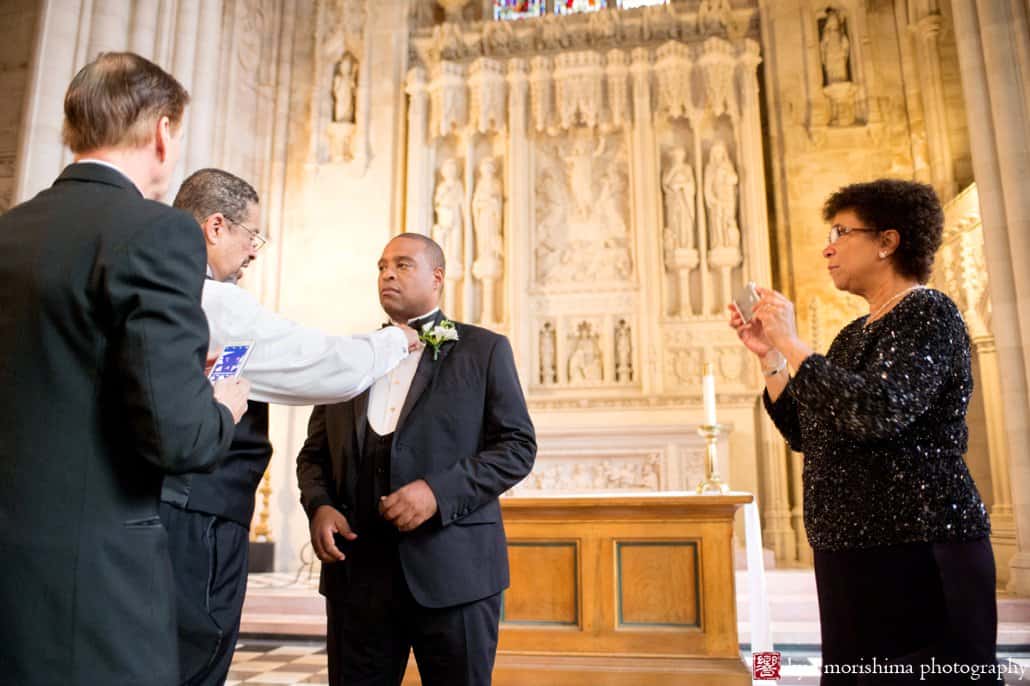 Relatives help groom get ready before St. John the Divine wedding begins, photographed by Kyo Morishima
