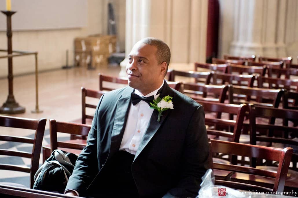 Groom sits in a chair, waiting for St. John the Divine wedding to begin, photographed by Kyo Morishima
