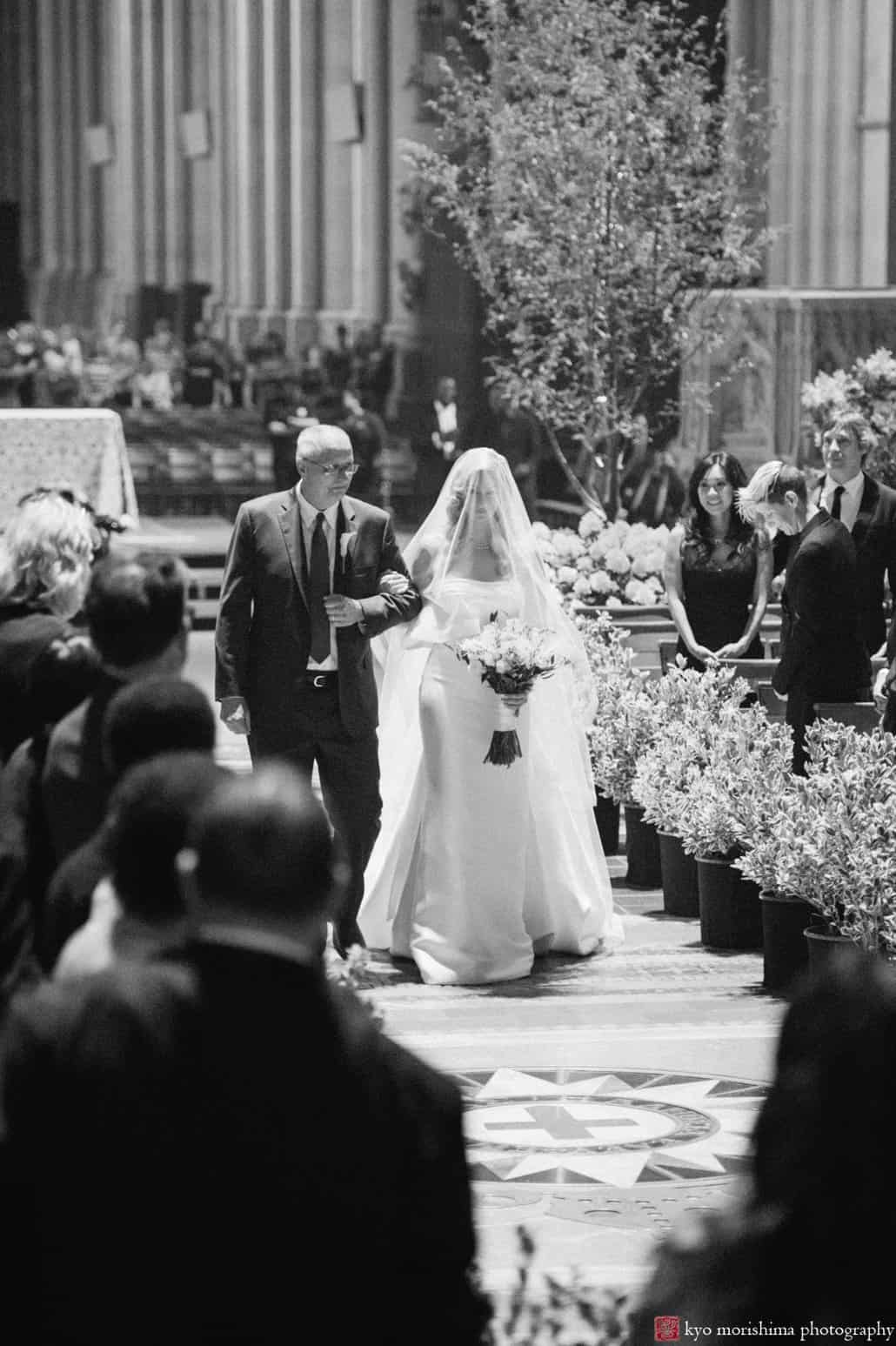 Bride and uncle walk down the aisle at St. John the Divine wedding in the chapel, photographed by Kyo Morishima