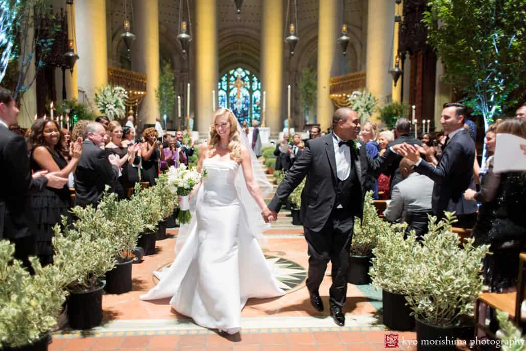 Bride and groom celebrate as St. John the Divine wedding ceremony ends, photographed by Kyo Morishima