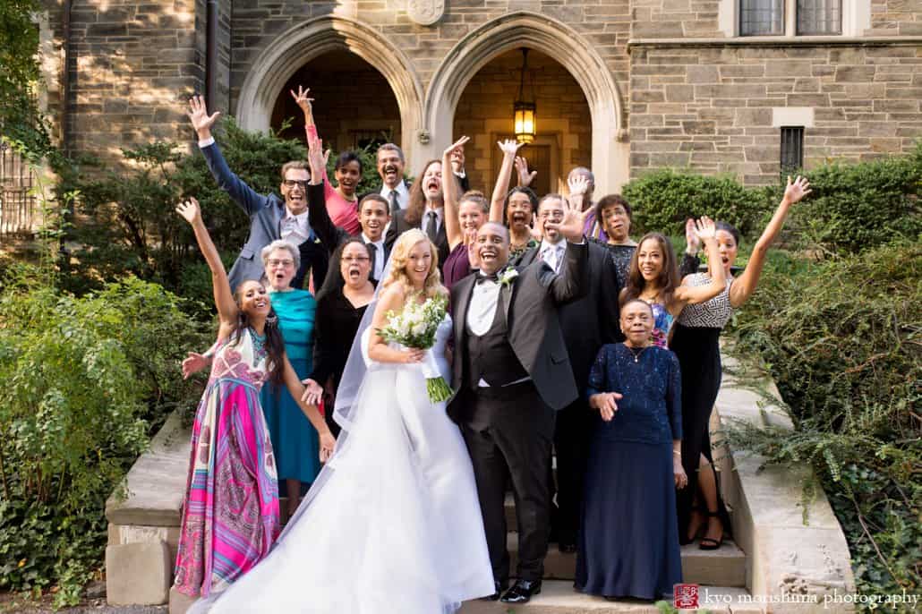 Bride and groom celebrate with family during St. John the Divine wedding portrait session