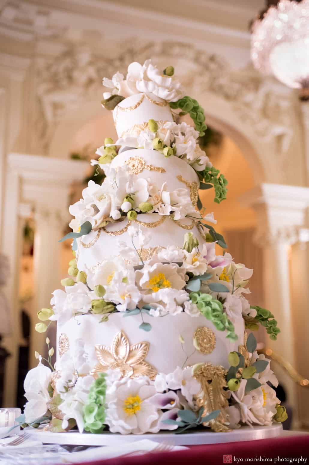 Ron Ben-Israel asymmetrical wedding cake with white flowers and gold embellishments at Lotos Club wedding in NYC, photographed by Kyo Morishima