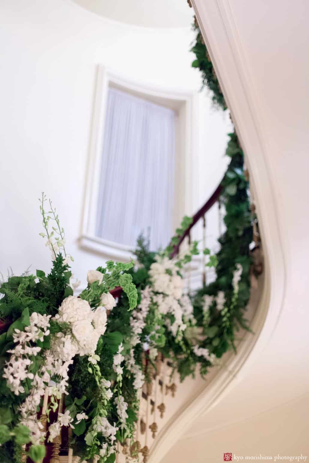 Franz James wedding flower decor on the Lotos Club spiral staircase photographed by Lotos Club wedding photographer Kyo Morishima