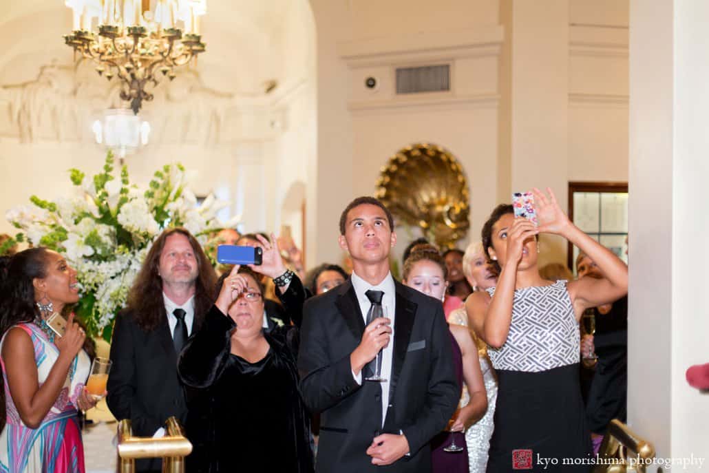 Guests watch bride and groom offer a toast during Lotos Club wedding, photographed by Kyo Morishima