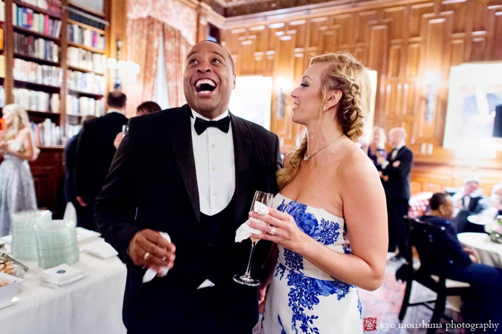 Bride and groom share a laugh in the library during Lotos Club wedding reception photographed by Kyo Morishima