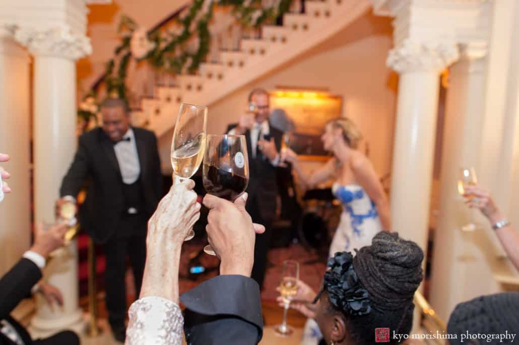 A toast in the foyer at Lotos Club wedding reception photographed by Kyo Morishima