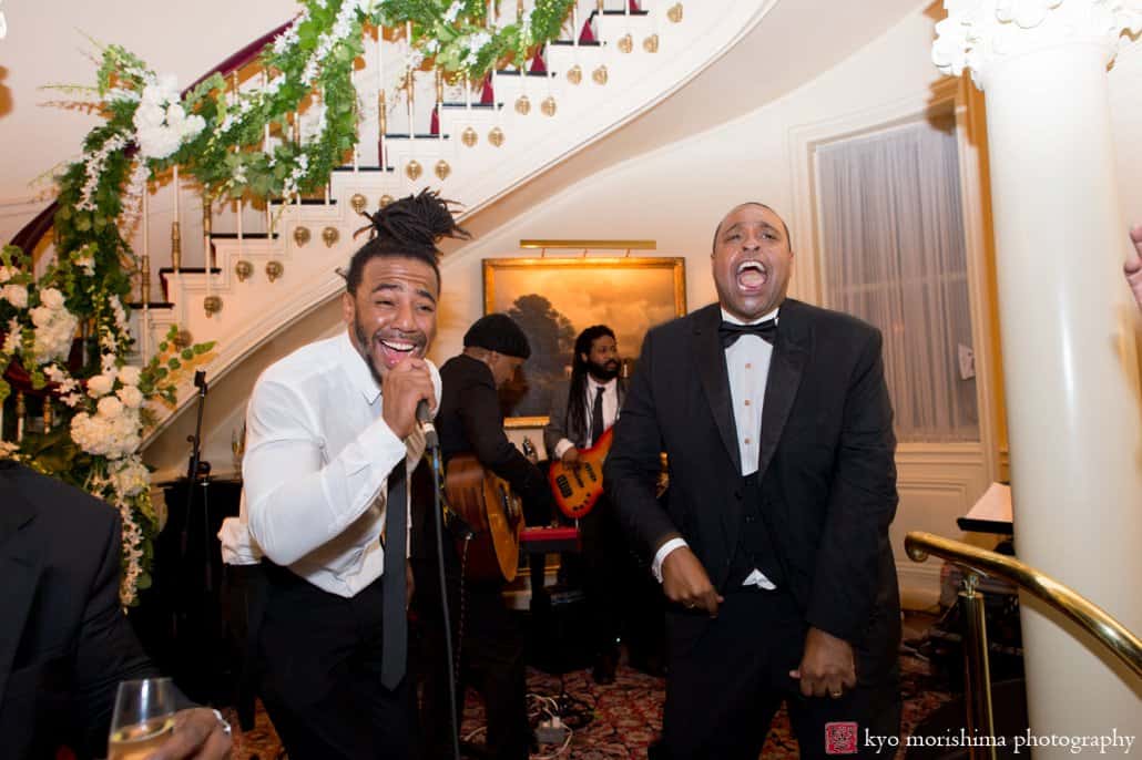 Groom and musician sing at Lotos Club wedding reception photographed by Kyo Morishima
