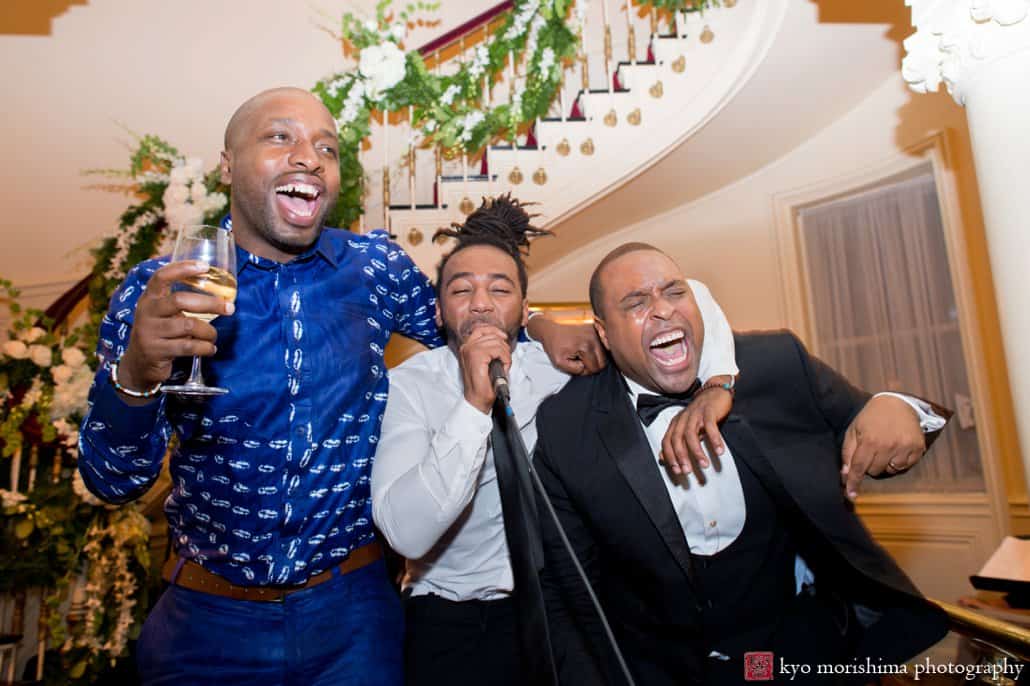 Groom and friends sing during Lotos Club wedding reception photographed by Kyo Morishima