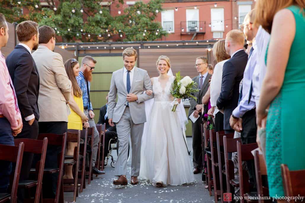 Bride cries as she walks down the aisle at Green Building outdoor wedding, photographed by Brooklyn wedding photographer Kyo Morishima