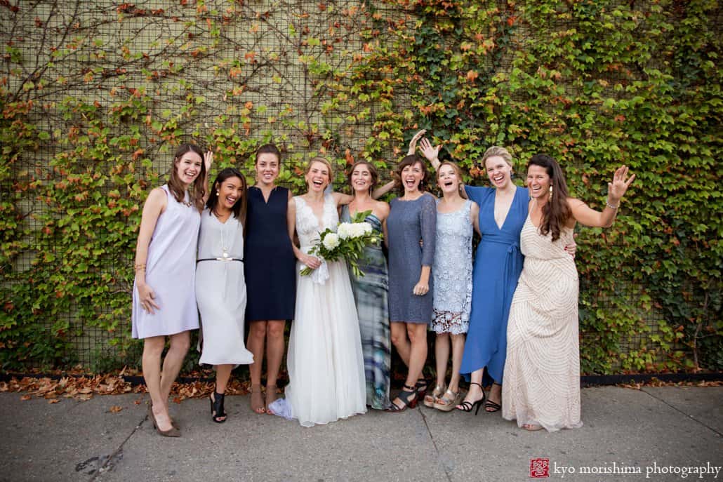 Bride poses with friends after Green Building wedding, photographed by Kyo Morishima