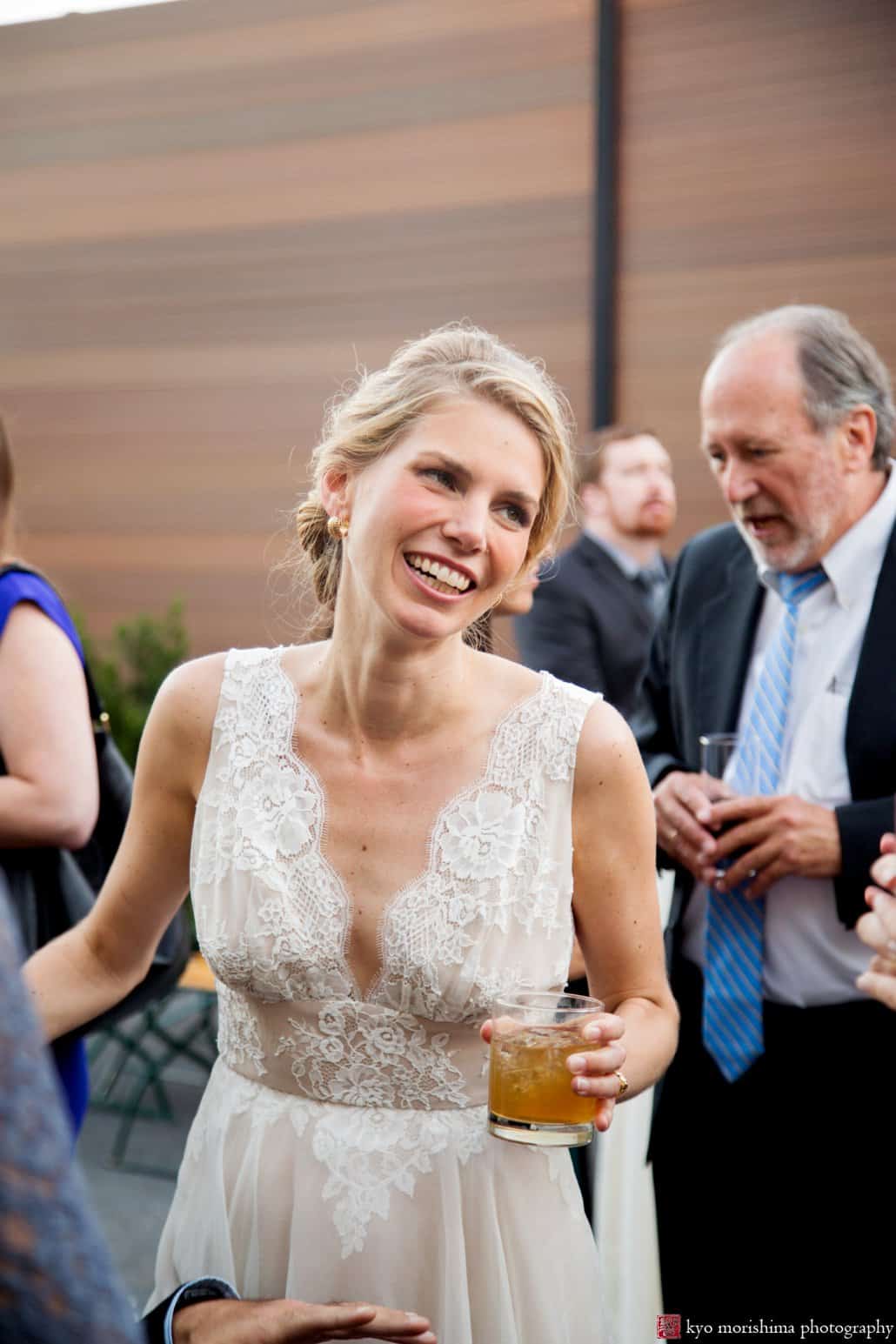 Bride smiles during outdoor cocktail hour at Green Building wedding in Brooklyn photographed by Kyo Morishima