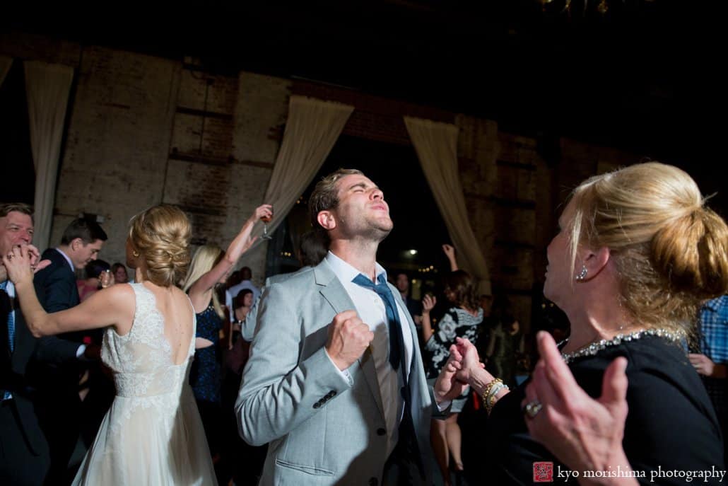 Guests dance to Brooklyn wedding DJ OP! at loft-style Brooklyn wedding, photographed by Kyo Morishima
